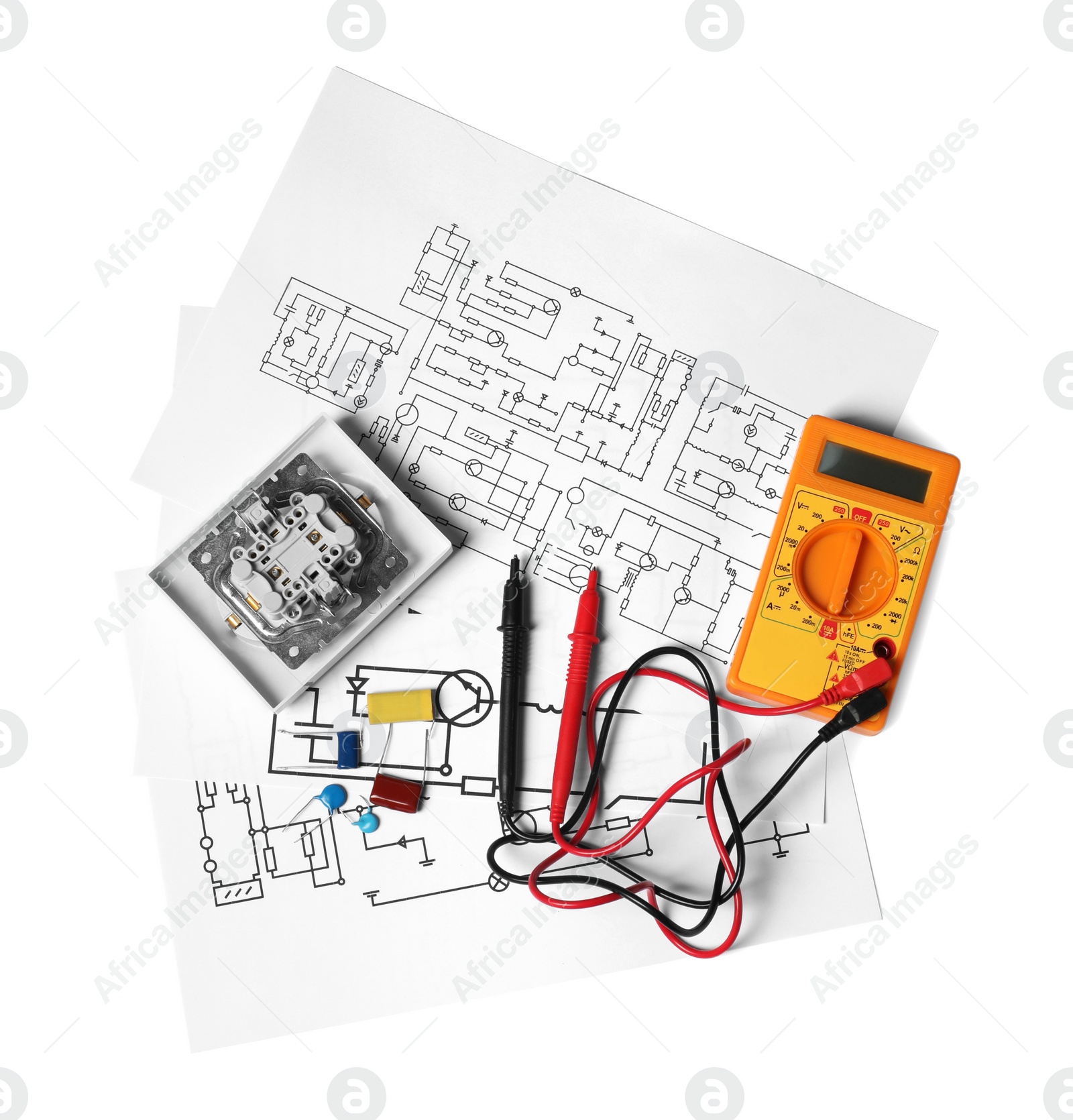 Photo of Wiring diagrams, digital multimeter and disassembled light switch isolated on white, top view