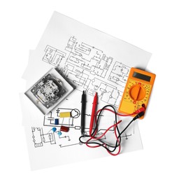 Photo of Wiring diagrams, digital multimeter and disassembled light switch isolated on white, top view