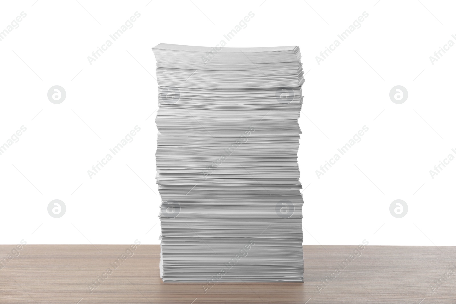 Photo of Stack of paper sheets on wooden table against white background