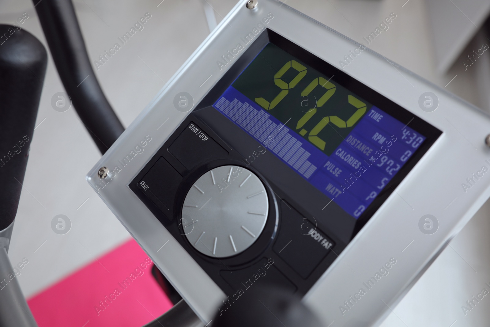 Photo of Control panel of modern elliptical machine cross trainer on blurred background