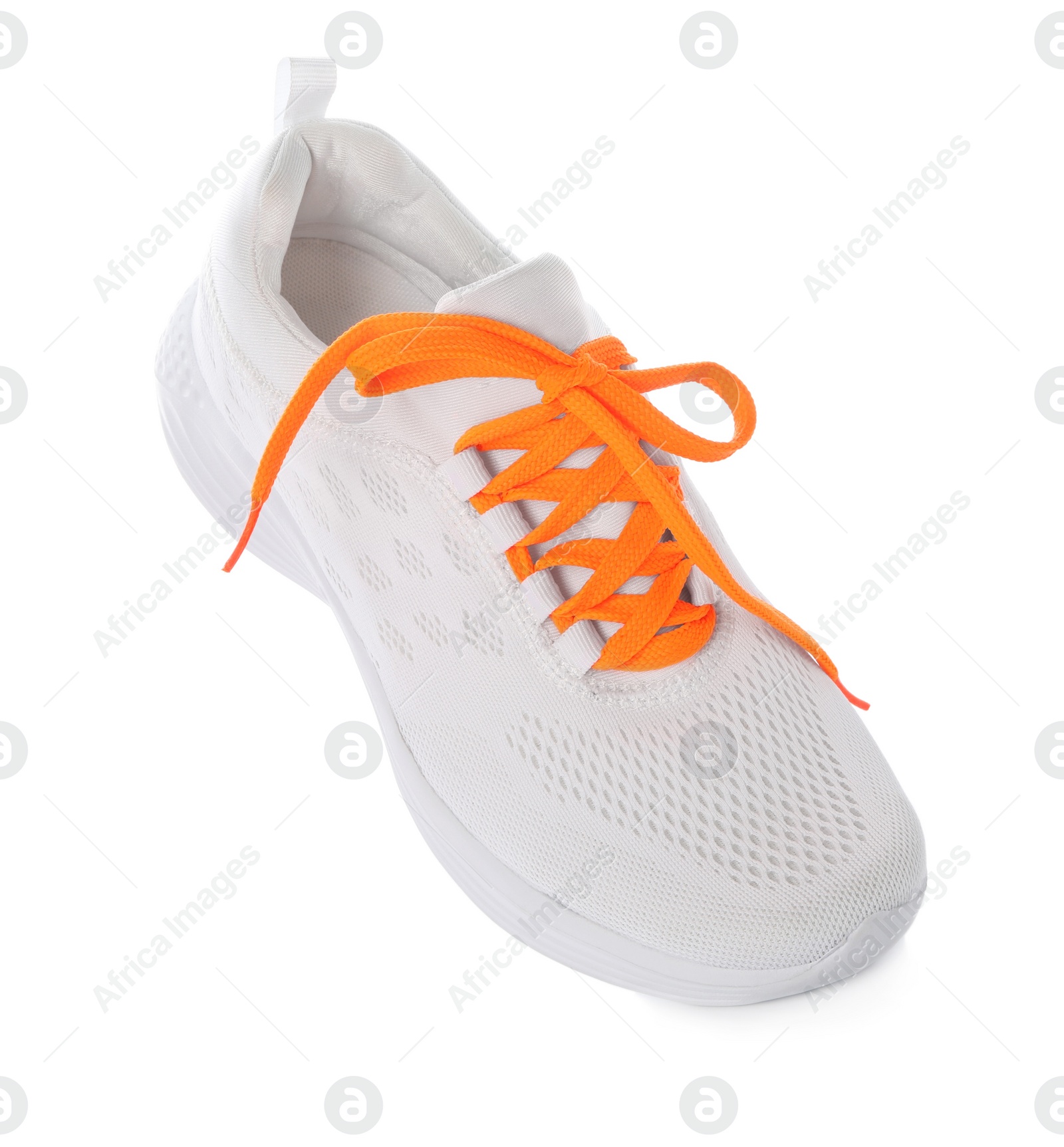 Photo of Stylish sneaker with orange shoelaces on white background