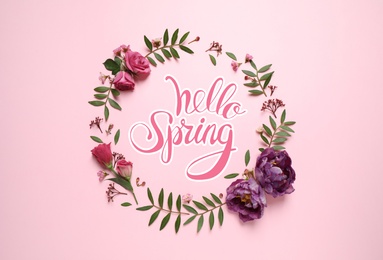 Image of Hello Spring. Frame made of beautiful flowers on pink background, flat lay