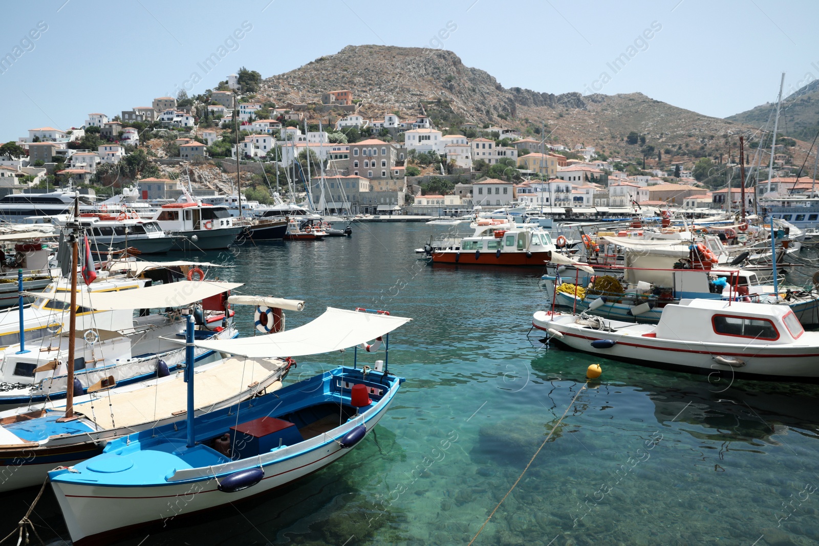 Photo of Beautiful view of coastal city with different boats on sunny day