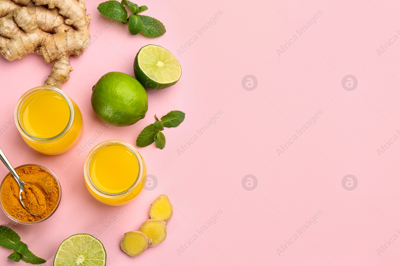 Photo of Flat lay composition with immunity boosting drink on pink background. Space for text