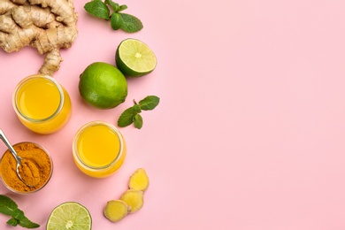 Flat lay composition with immunity boosting drink on pink background. Space for text