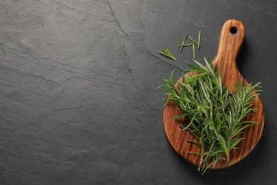 Fresh green rosemary on grey table, top view. Space for text