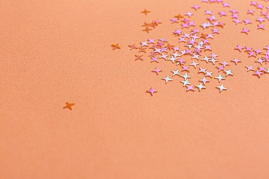 Shiny bright glitter on pink background. Space for text