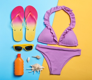 Flat lay composition with collection of beach objects on color background