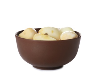 Photo of Bowl with preserved garlic on white background