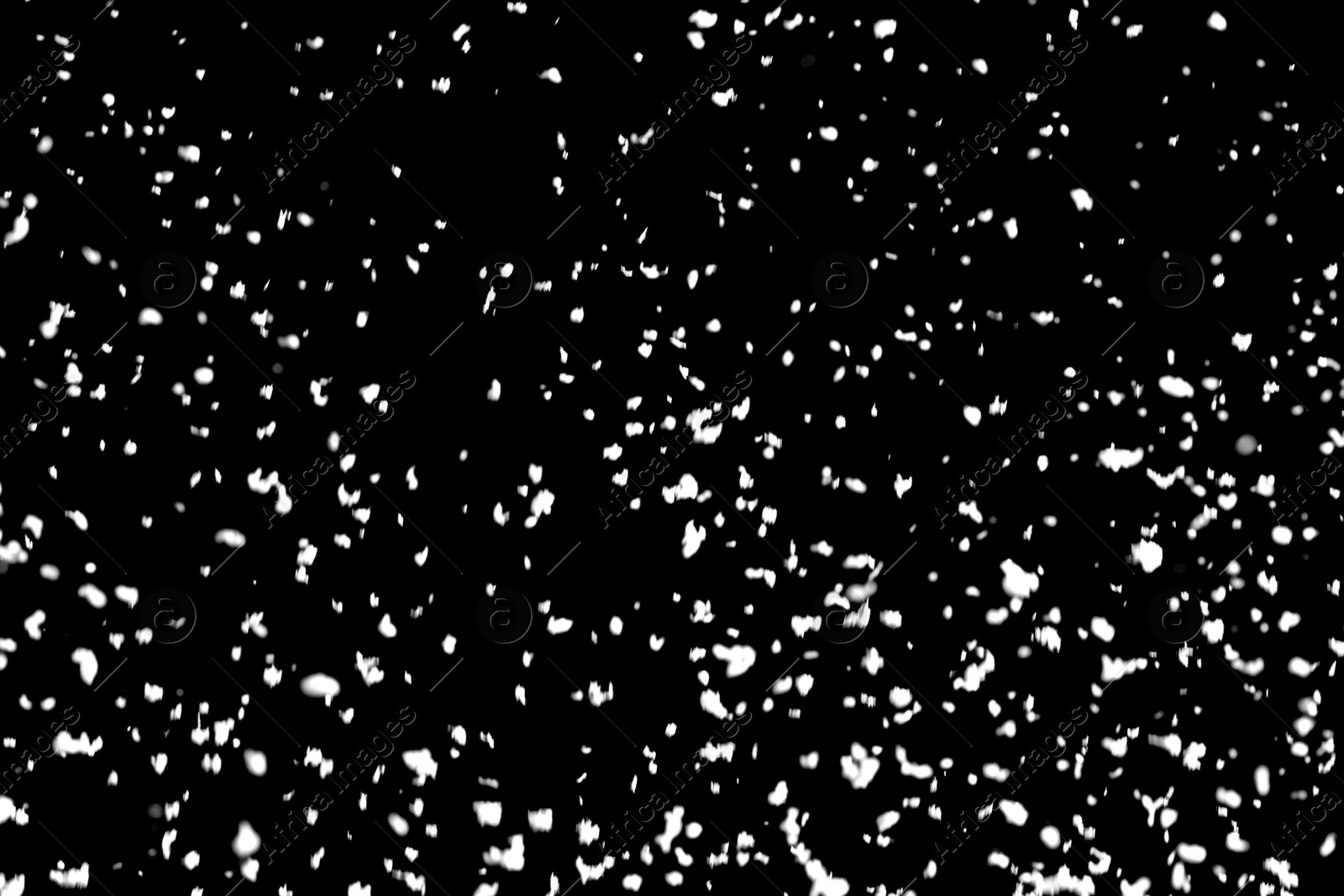 Photo of White snow falling down on black background