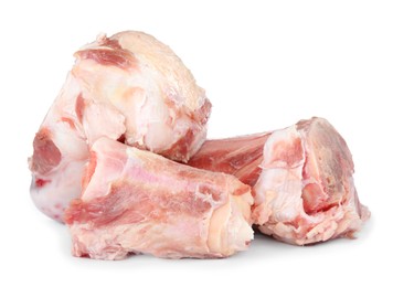 Photo of Raw chopped meaty bones on white background