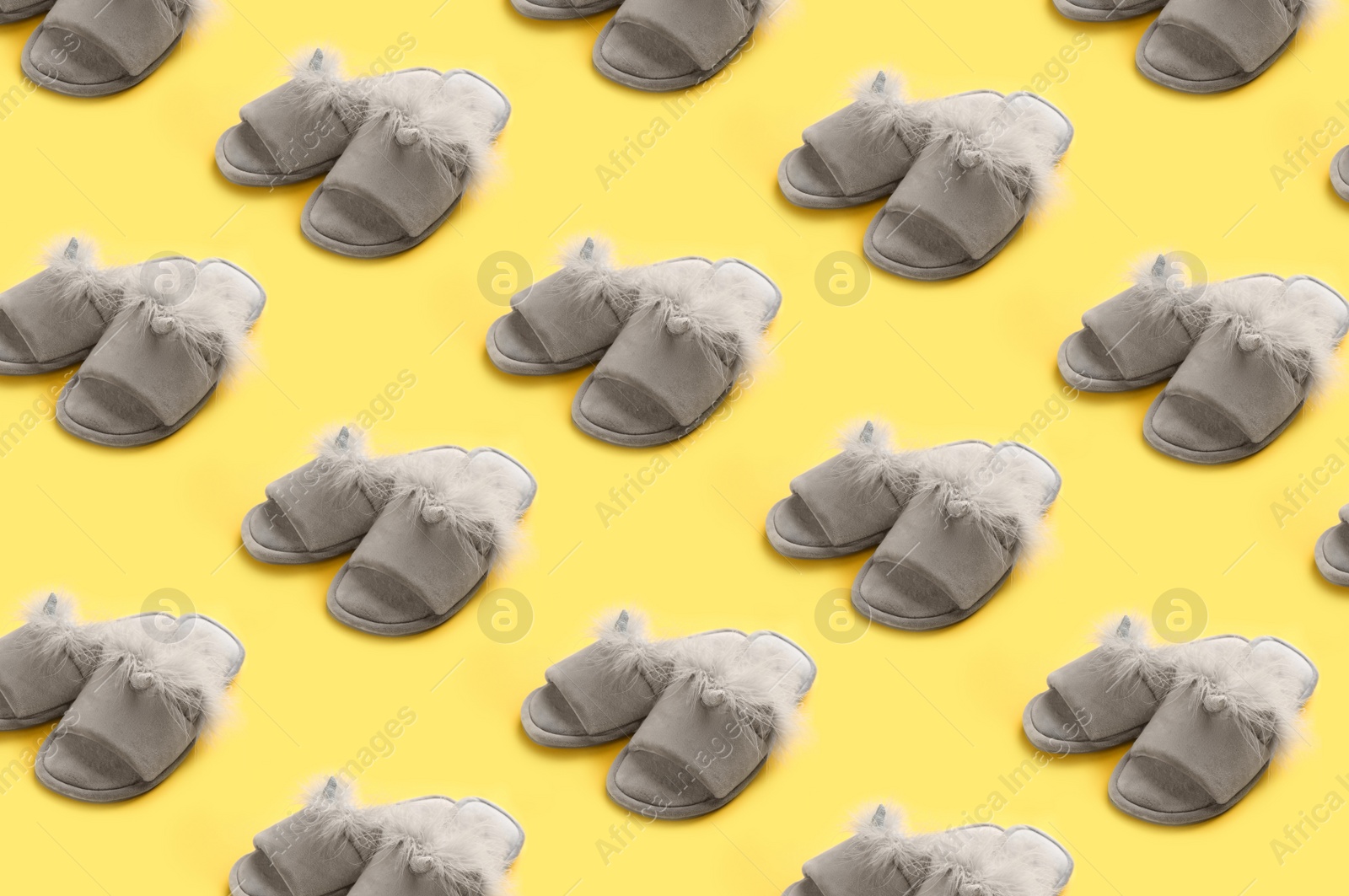 Image of Soft slippers on yellow background, pattern design 