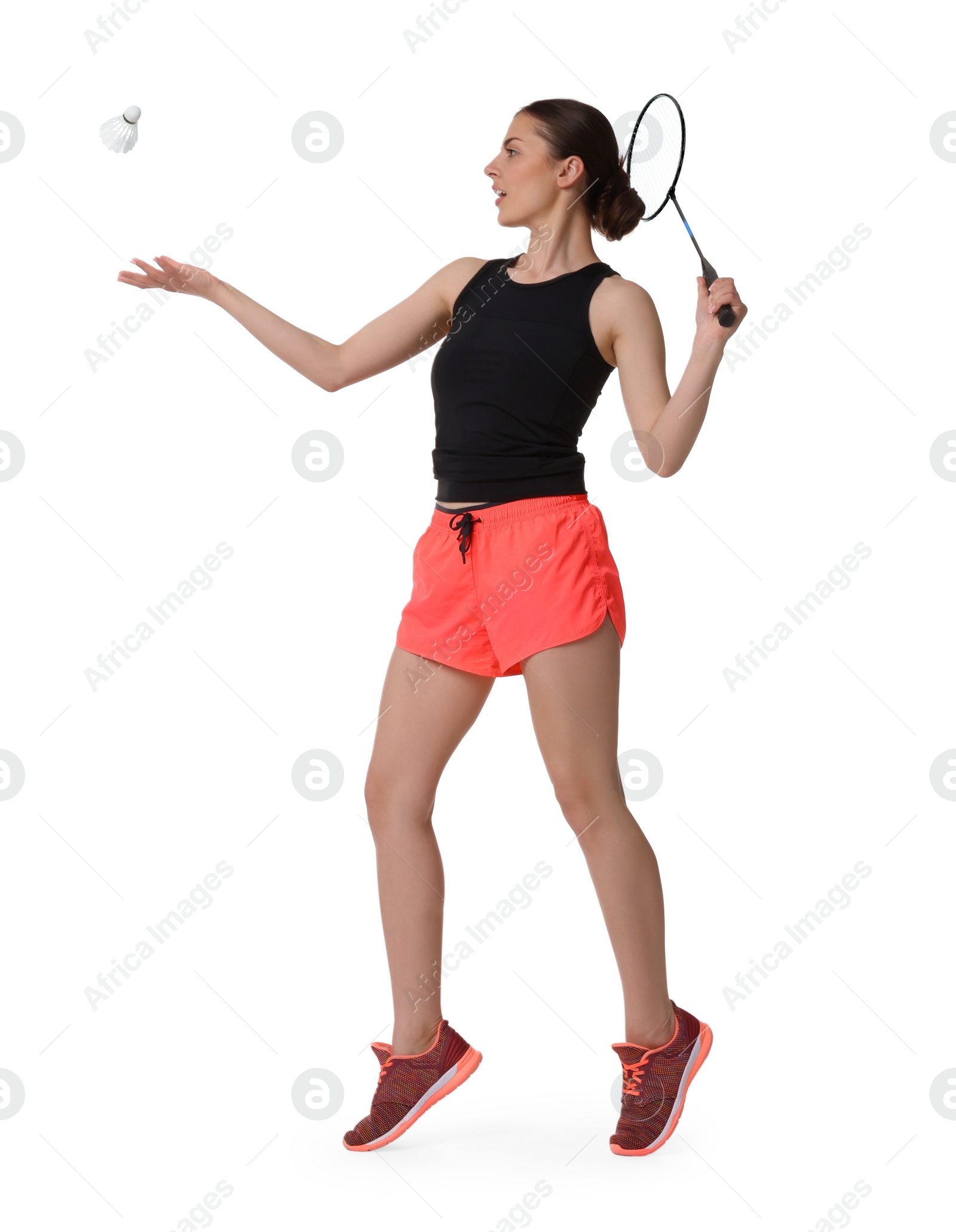 Photo of Young woman playing badminton with racket and shuttlecock on white background