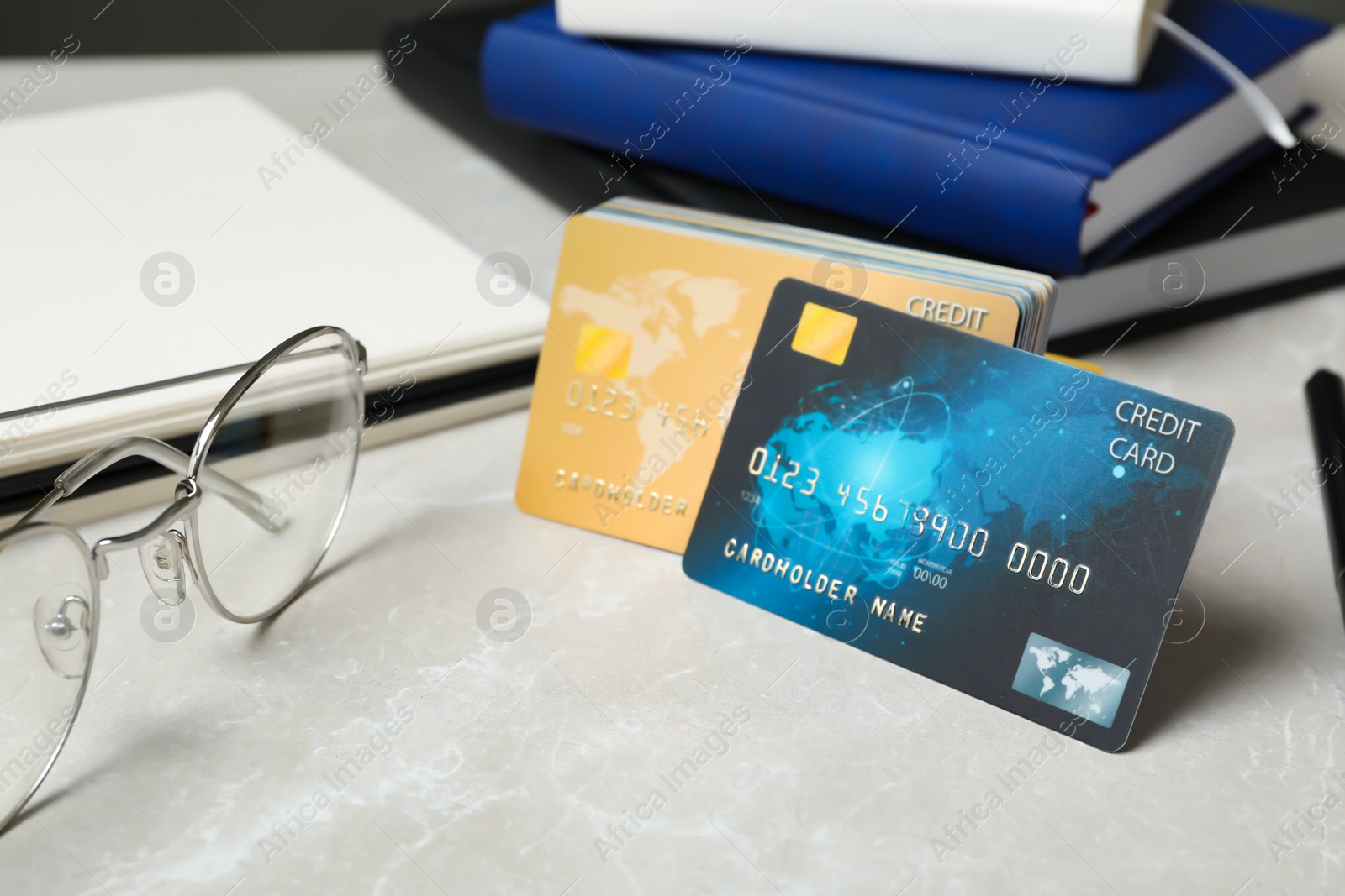 Photo of Many different credit cards on light grey marble table