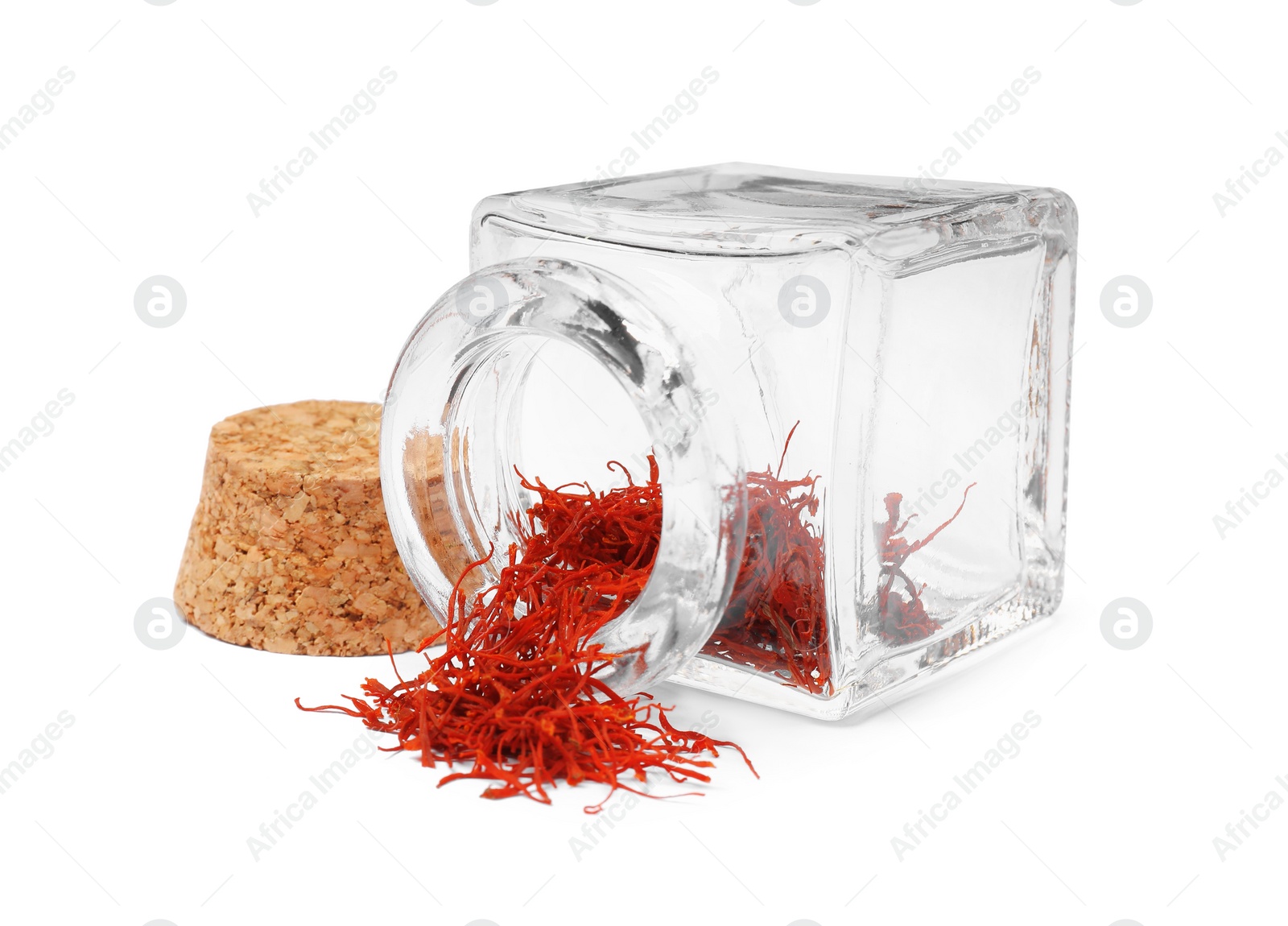 Photo of Aromatic saffron and glass jar isolated on white