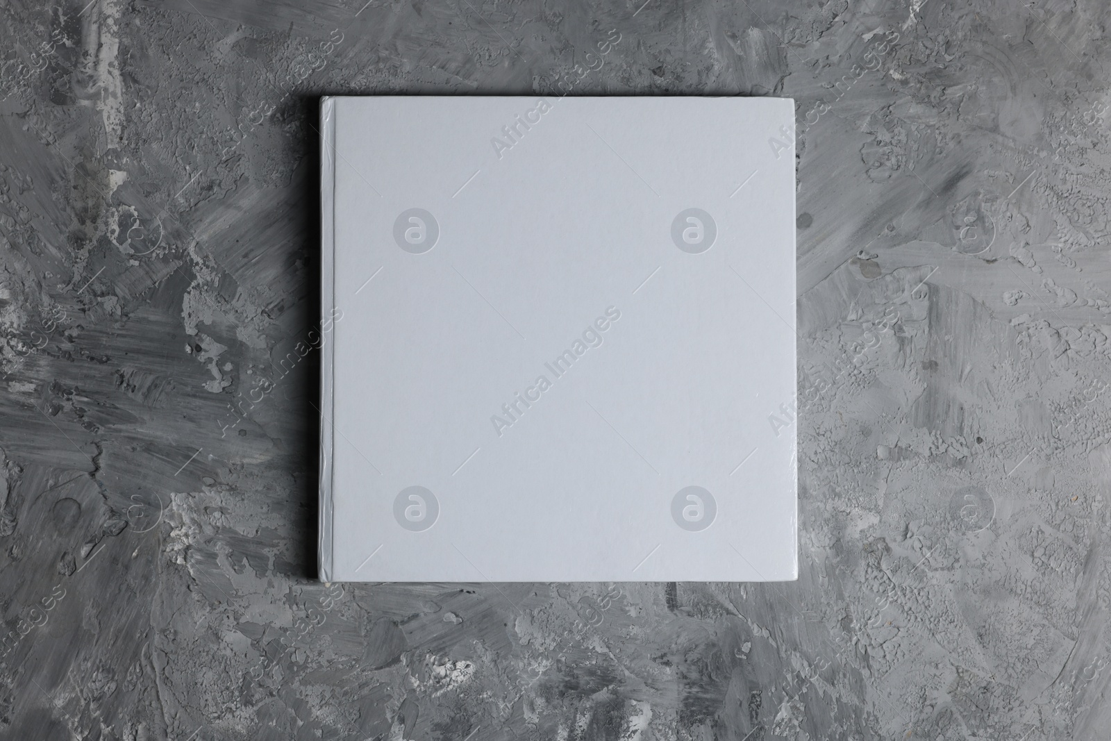 Photo of Blank paper sheets on grey textured background, top view. Mockup for design