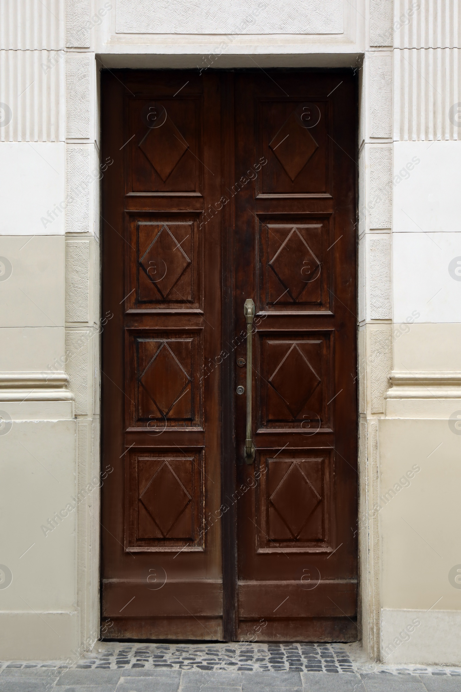 Photo of View of building with vintage wooden door. Exterior design