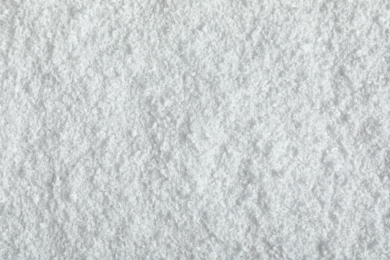 Photo of Pile of white snow as background, top view