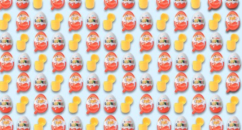 Image of Mykolaiv, Ukraine - June 26, 2023: Kinder Surprise and Joy Eggs and yellow capsule with toy on light blue background, seamless pattern design