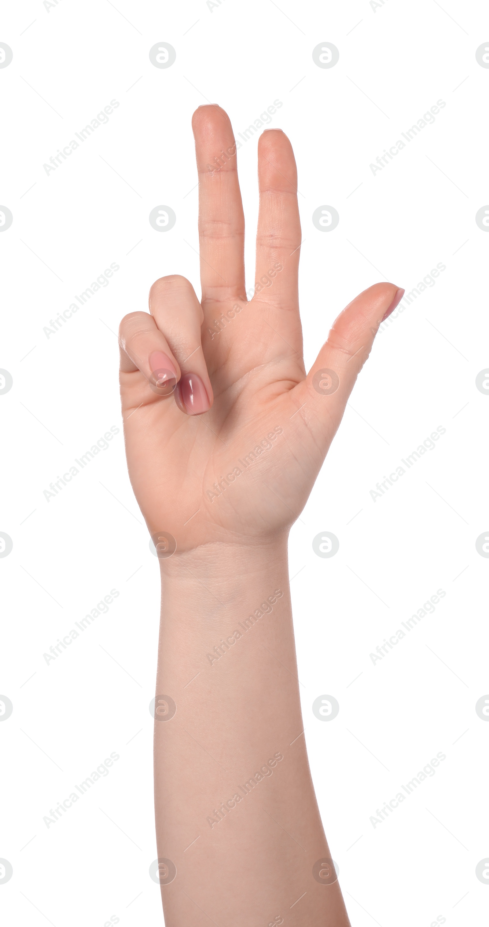 Photo of Playing rock, paper and scissors. Woman making scissors with her fingers on white background, closeup