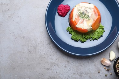 Photo of Delicious chicken aspic served on grey table, flat lay. Space for text