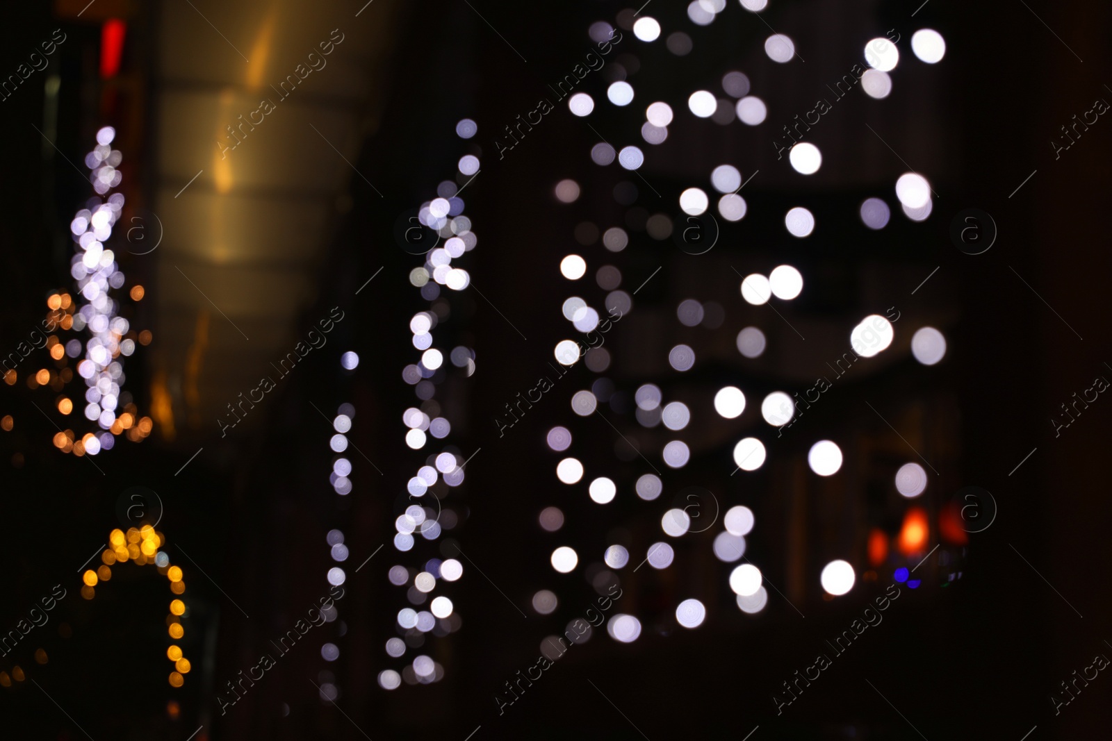 Photo of Beautiful street lights at night. Bokeh effect