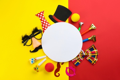Photo of Flat lay composition with clown's accessories and card on color background, space for text