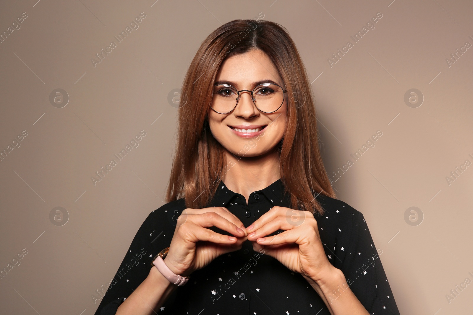 Photo of Woman using sign language on color background