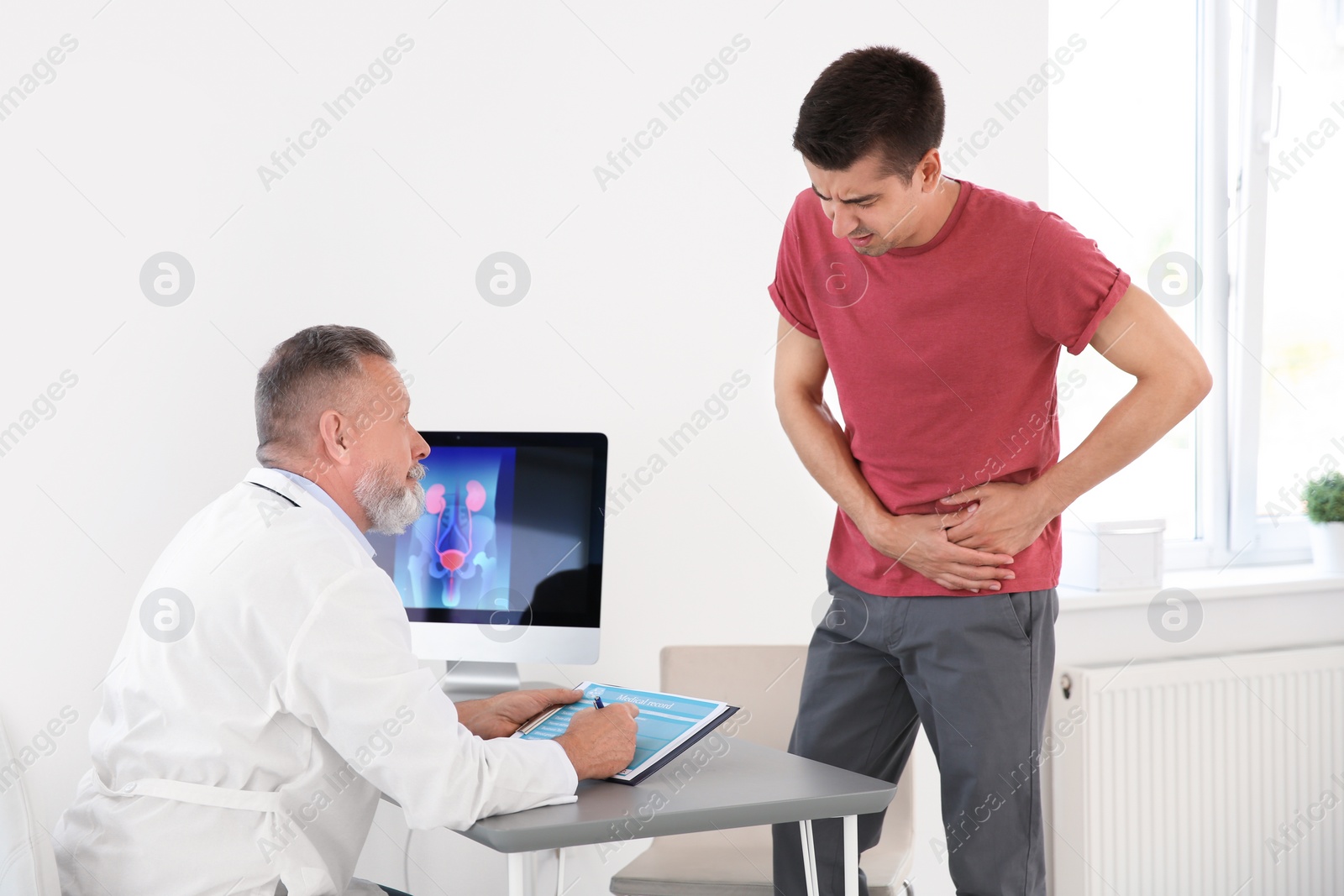 Photo of Man with health problem visiting urologist at hospital