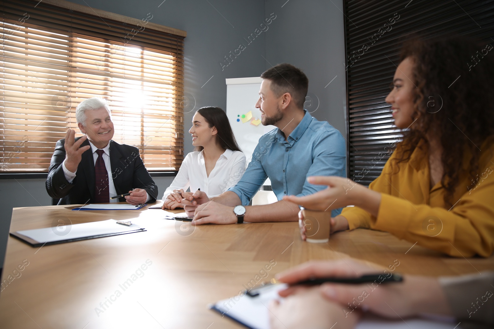 Photo of Group of people discussing questions at business seminar