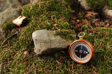 Photo of Compass on ground outdoors, space for text