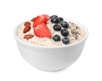 Photo of Tasty boiled oatmeal with berries, almonds and chia seeds in bowl isolated on white