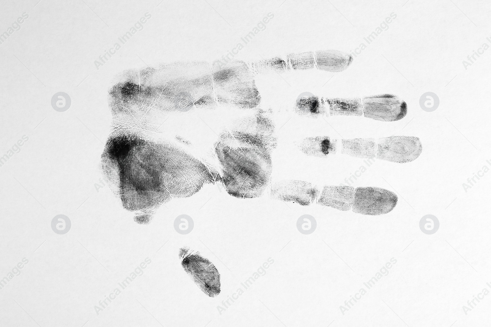 Photo of Print of hand and fingers on white background, top view. Criminal investigation