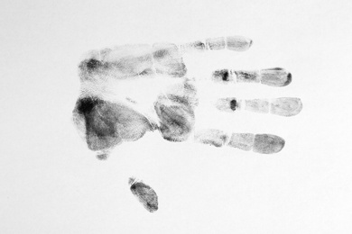 Print of hand and fingers on white background, top view. Criminal investigation