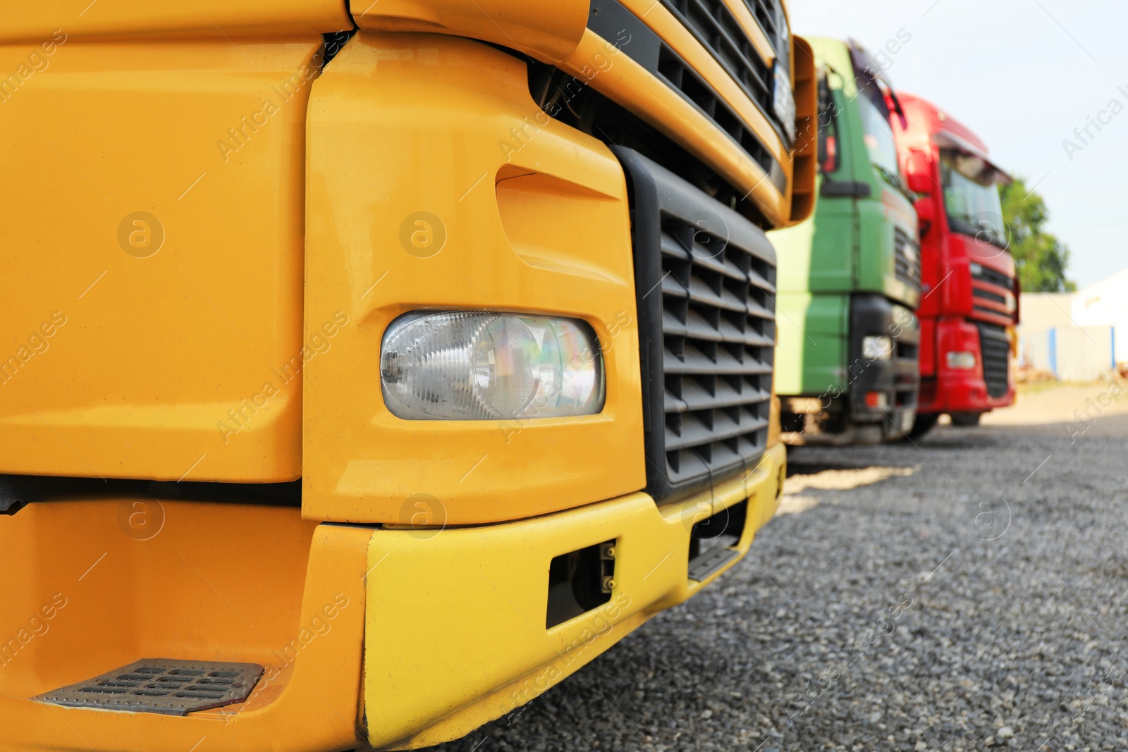 Photo of Modern bright trucks on stop, closeup view