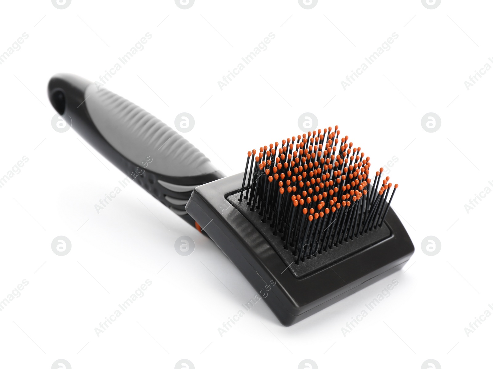 Photo of Brush for cat on white background. Pet care