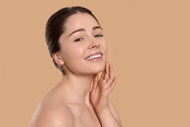 Photo of Portrait of attractive young woman on beige background, space for text. Spa treatment