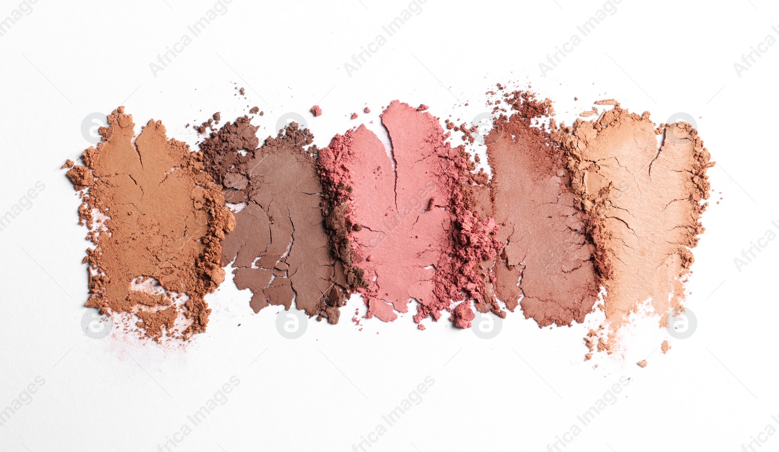 Photo of Crushed eye shadows on white background, top view. Professional makeup product