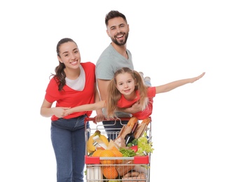 Photo of Happy family with shopping cart full of groceries on white background