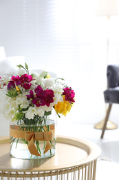 Photo of Beautiful bouquet with spring freesia flowers in light room