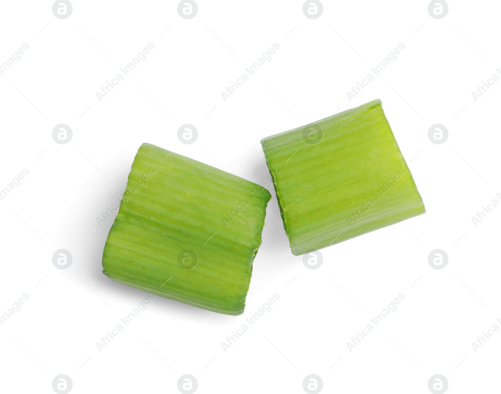 Photo of Pieces of fresh green onion on white background, top view