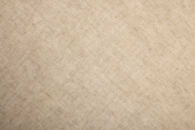 Photo of Texture of natural burlap fabric as background, top view