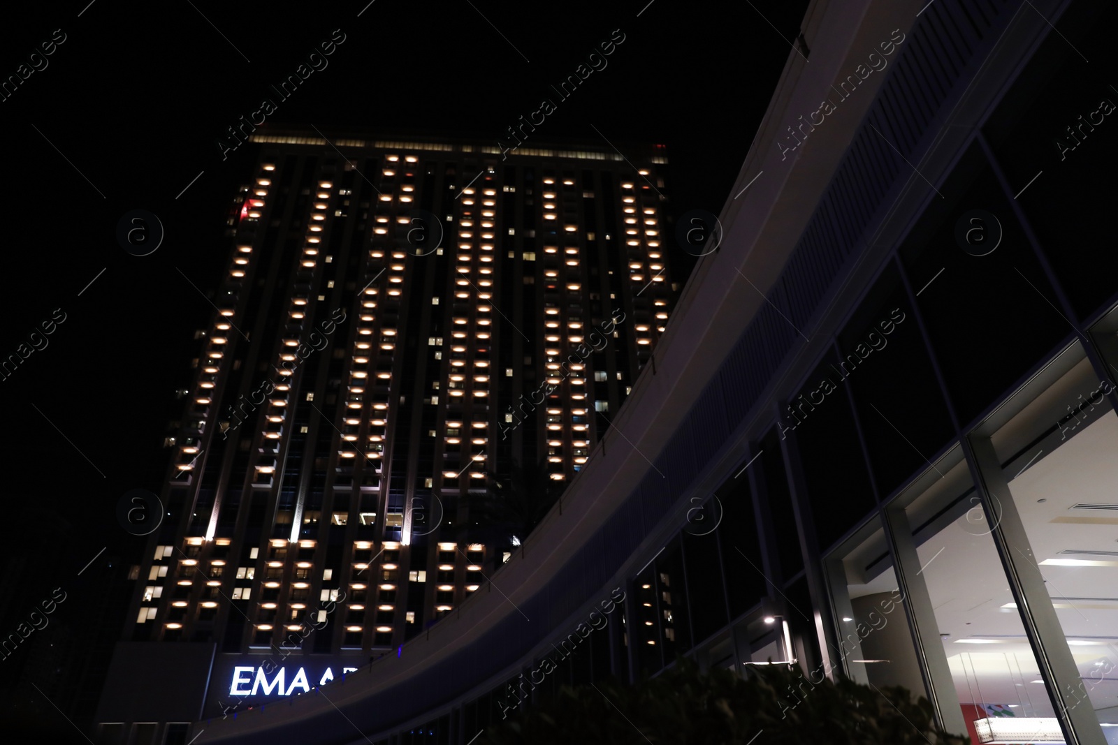 Photo of DUBAI, UNITED ARAB EMIRATES - NOVEMBER 03, 2018: Night cityscape with illuminated building