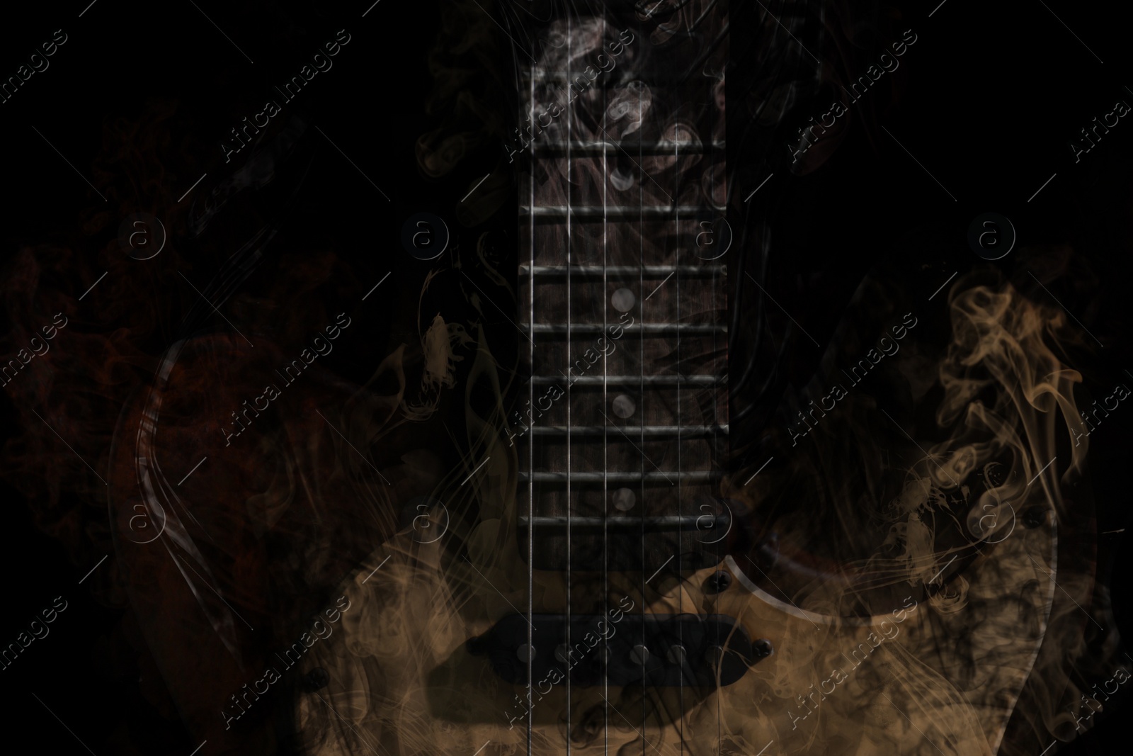 Image of Electric guitar and smoke on black background, closeup. Stylish design. Rock music concept