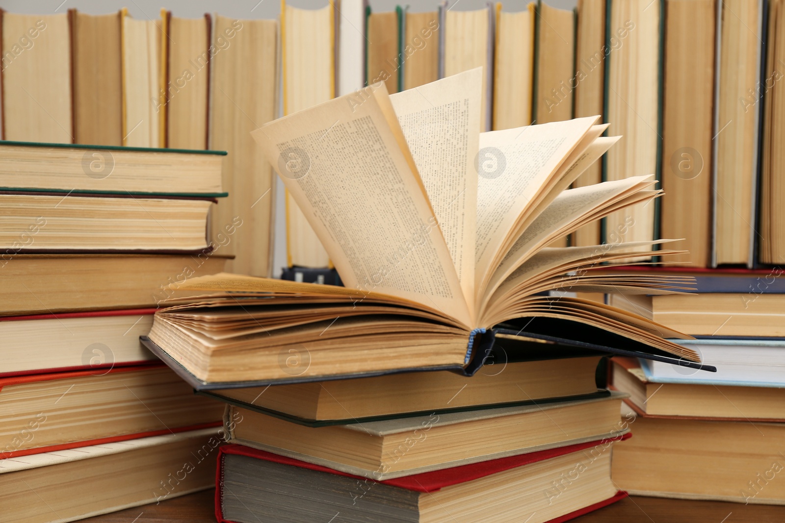 Photo of Many hardcover books as background, closeup. Library material