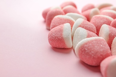 Photo of Closeup of sweet jelly candies on pink background. Space for text