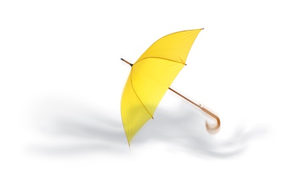 Image of Open umbrella blown by wind gust on white background
