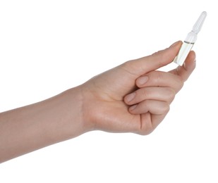 Photo of Woman holding glass ampoule with medication on white background, closeup