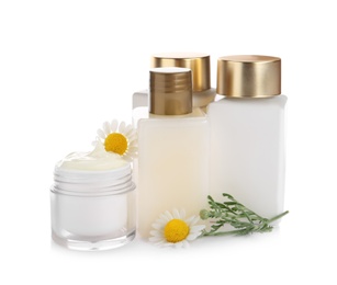 Set of different cosmetic products and chamomile flowers on white background