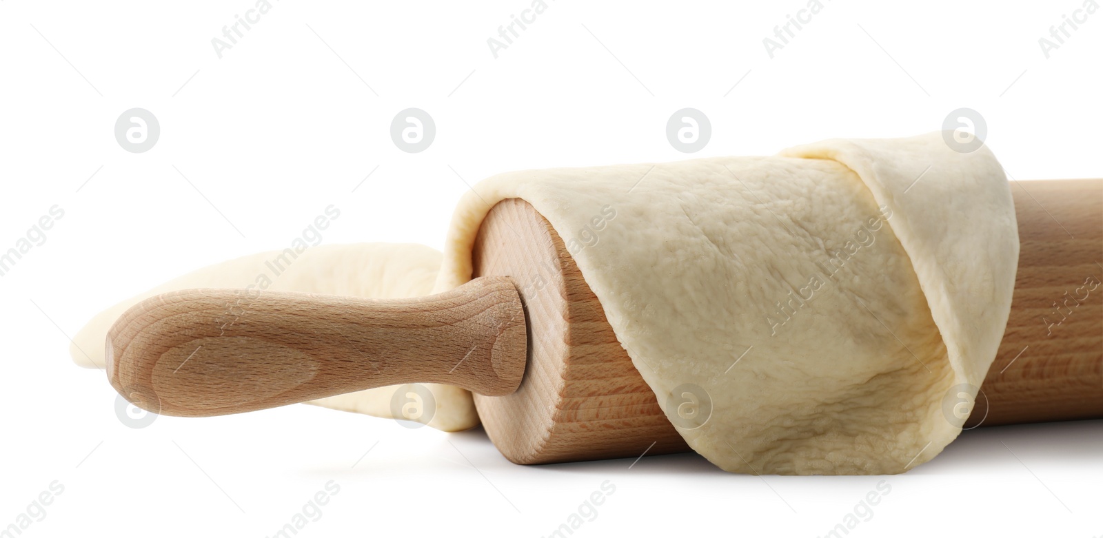 Photo of Raw dough and rolling pin isolated on white